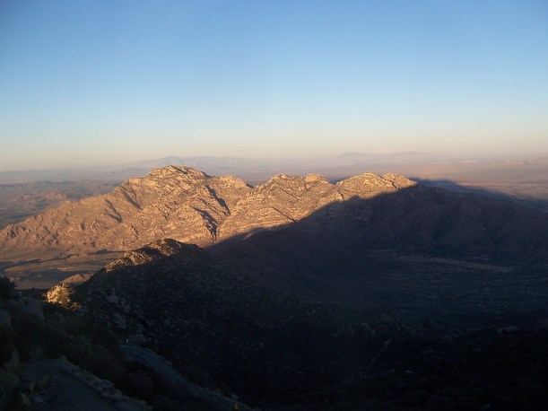 The mountain making a shadow on another mountain.